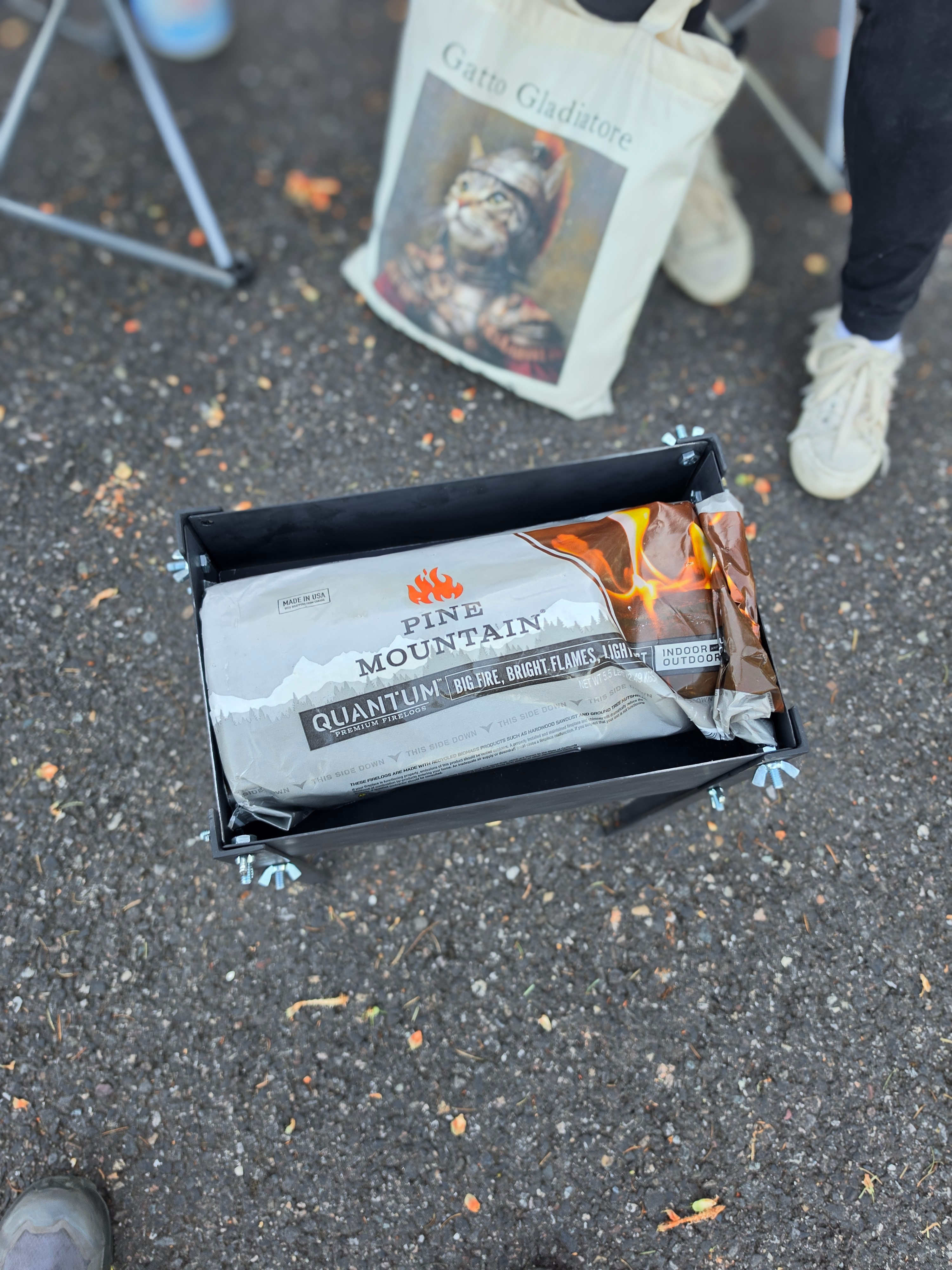 The flat-pack firepit shown for size next to firewood